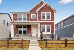 View of front of home featuring board and batten siding and covered porch
