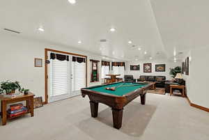 Recreation room with pool table and recessed lighting