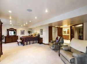 Bedroom featuring light carpet and recessed lighting