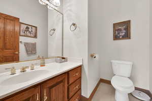 Bathroom featuring vanity and light tile patterned floors
