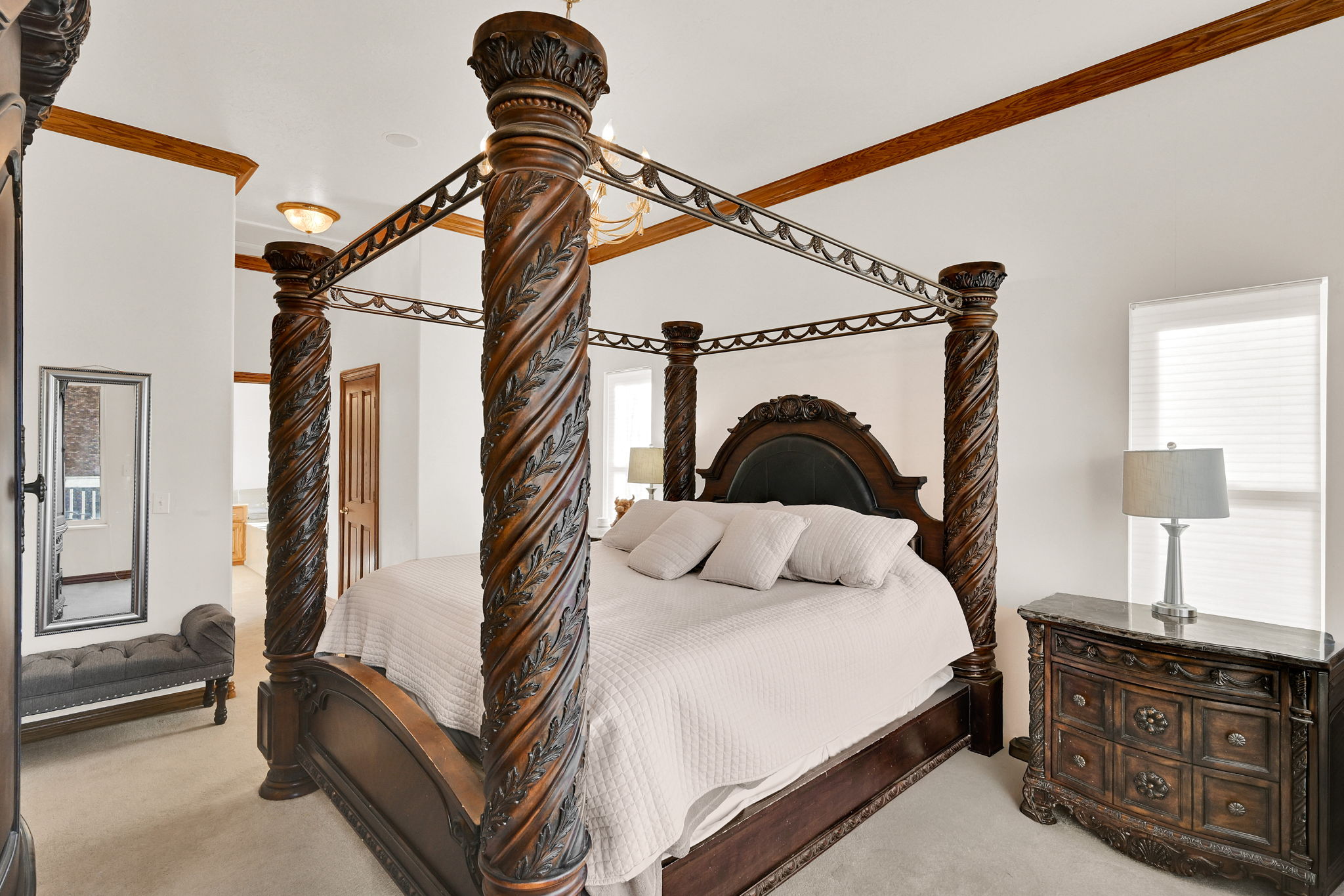 Bedroom featuring ornamental molding and light carpet