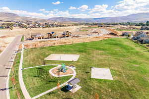 Bird's eye view of a mountainous background and a community park