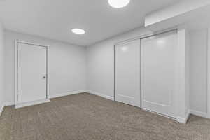Unfurnished bedroom with carpet floors and a closet