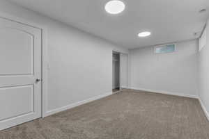 Unfurnished bedroom featuring carpet and a closet