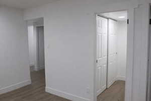 Hall featuring light wood-type flooring