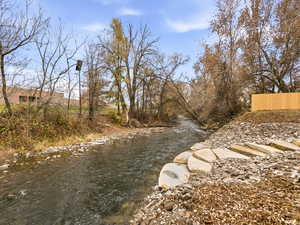 View of yard with a water view