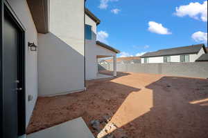 Fenced backyard with a patio area
