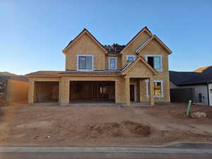 View of front facade with dirt driveway