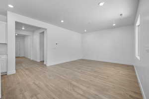 Unfurnished room featuring light wood-style floors and recessed lighting