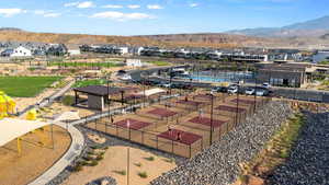 Aerial perspective of suburban area featuring a mountainous background