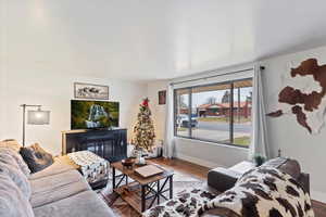 Living room with wood finished floors and baseboards