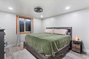 Bedroom featuring light wood-style floors and recessed lighting