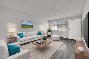 Living area with wood finished floors and baseboards