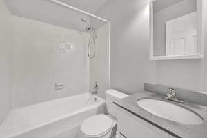 Bathroom featuring vanity and shower / bathtub combination