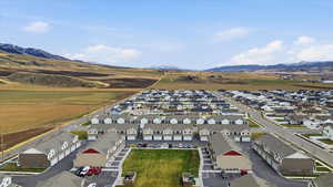 Aerial perspective of suburban area featuring a mountain backdrop