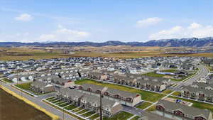 Aerial perspective of suburban area with a mountain backdrop