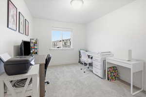 Office with light carpet and baseboards