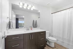 Bathroom featuring vanity and light wood finished floors