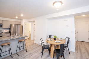 Dining space featuring recessed lighting and light wood-style floors
