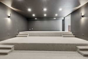 Home theater room with recessed lighting