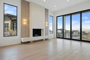 Main floor Living room with light wood-style flooring and recessed lighting