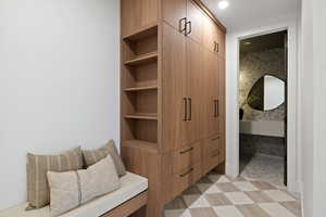 Mudroom featuring light flooring and recessed lighting