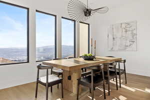 Dining area with light wood-style flooring and a mountain view