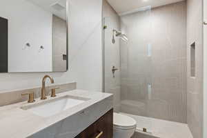 Full bath featuring vanity and walk in shower