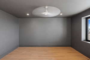 Spare room featuring light wood-style floors and recessed lighting