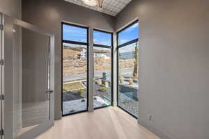 Entryway featuring wood finished floors and baseboards
