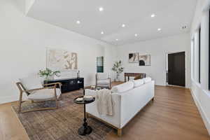 Upstairs Living room with recessed lighting and light wood-type flooring