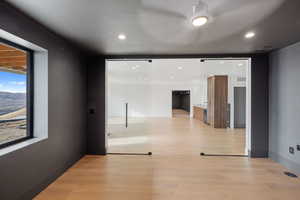 Unfurnished room featuring light wood finished floors and recessed lighting