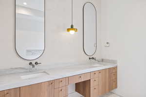 Primary  bathroom featuring double vanity