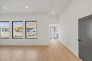 Upstairs living room featuring recessed lighting and light wood finished floors