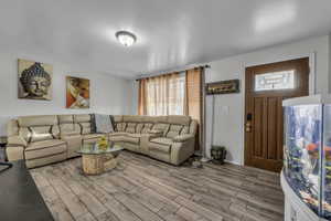 Living room featuring wood finish floors