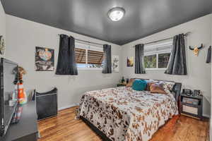 Bedroom with wood finished floors