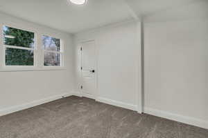 Spare room with carpet flooring and baseboards