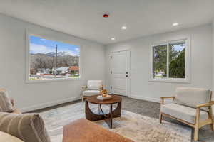 Sitting room with healthy amount of natural light, recessed lighting, and a mountain view