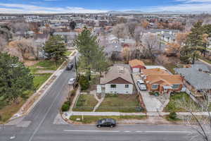 Aerial overview of property's location featuring nearby suburban area and mountains