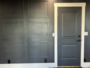 Family room with door leading to garage