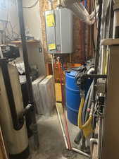 Utility room featuring water heater