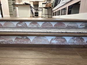 Detailed view of steps from family room to dining area