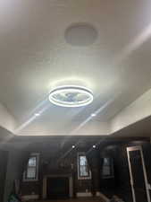 Detailed view of a textured ceiling and a raised ceiling