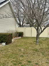 View of fenced  front side yard