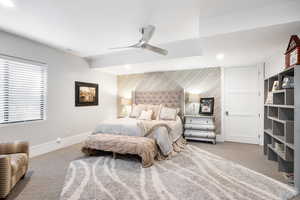 Bedroom with an accent wall, carpet, a ceiling fan, recessed lighting, and wood walls