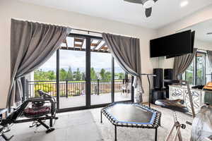 Workout area featuring ceiling fan