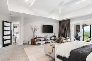 Carpeted bedroom with access to exterior, beamed ceiling, a ceiling fan, and french doors