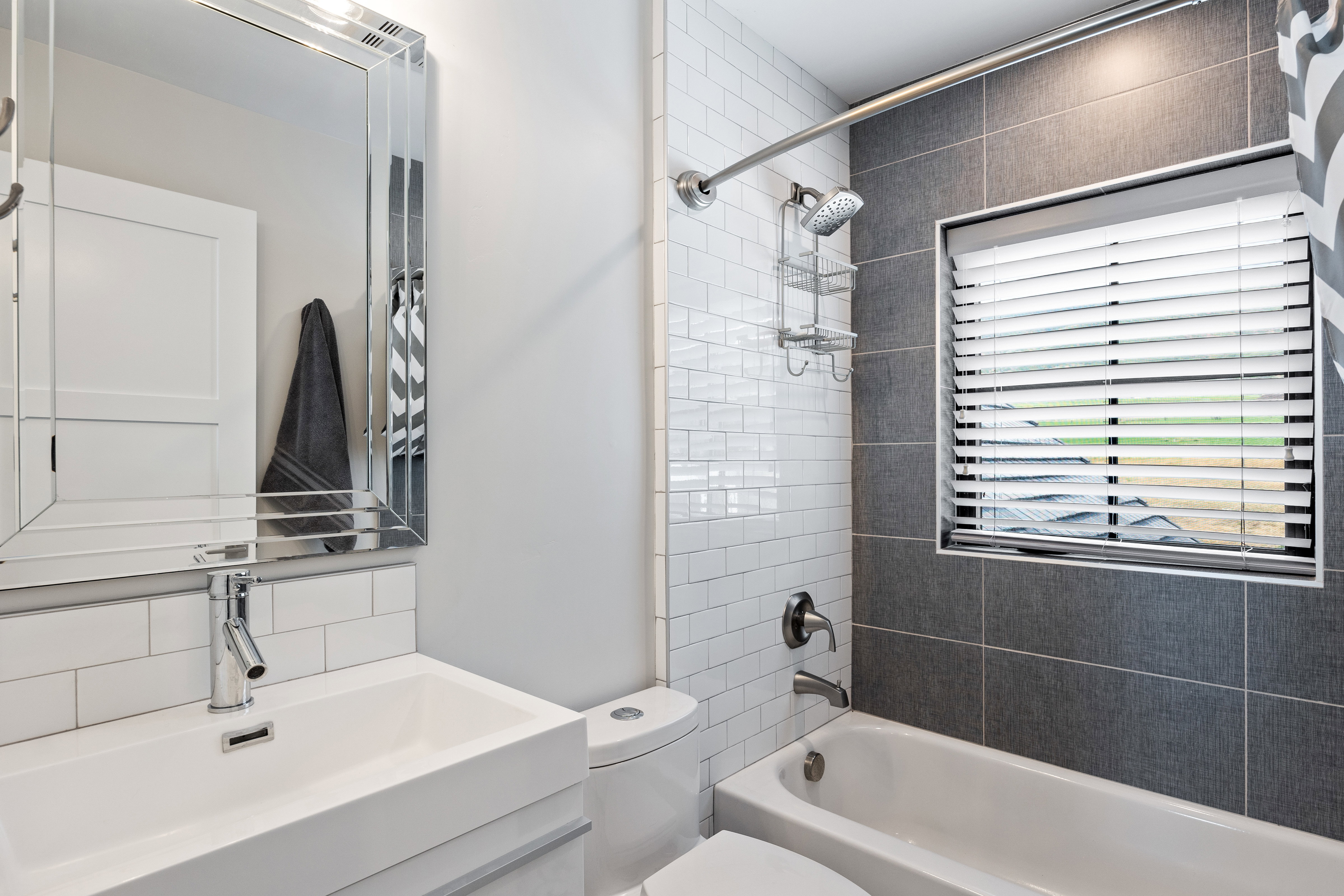 Full bath with tub / shower combination, backsplash, and vanity