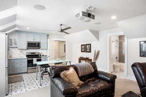 Living room with recessed lighting and ceiling fan