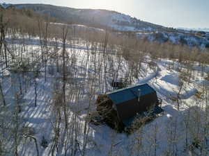 Snowy aerial view with a mountain view